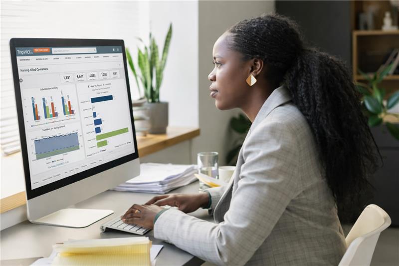Woman Using Trio On Computer
