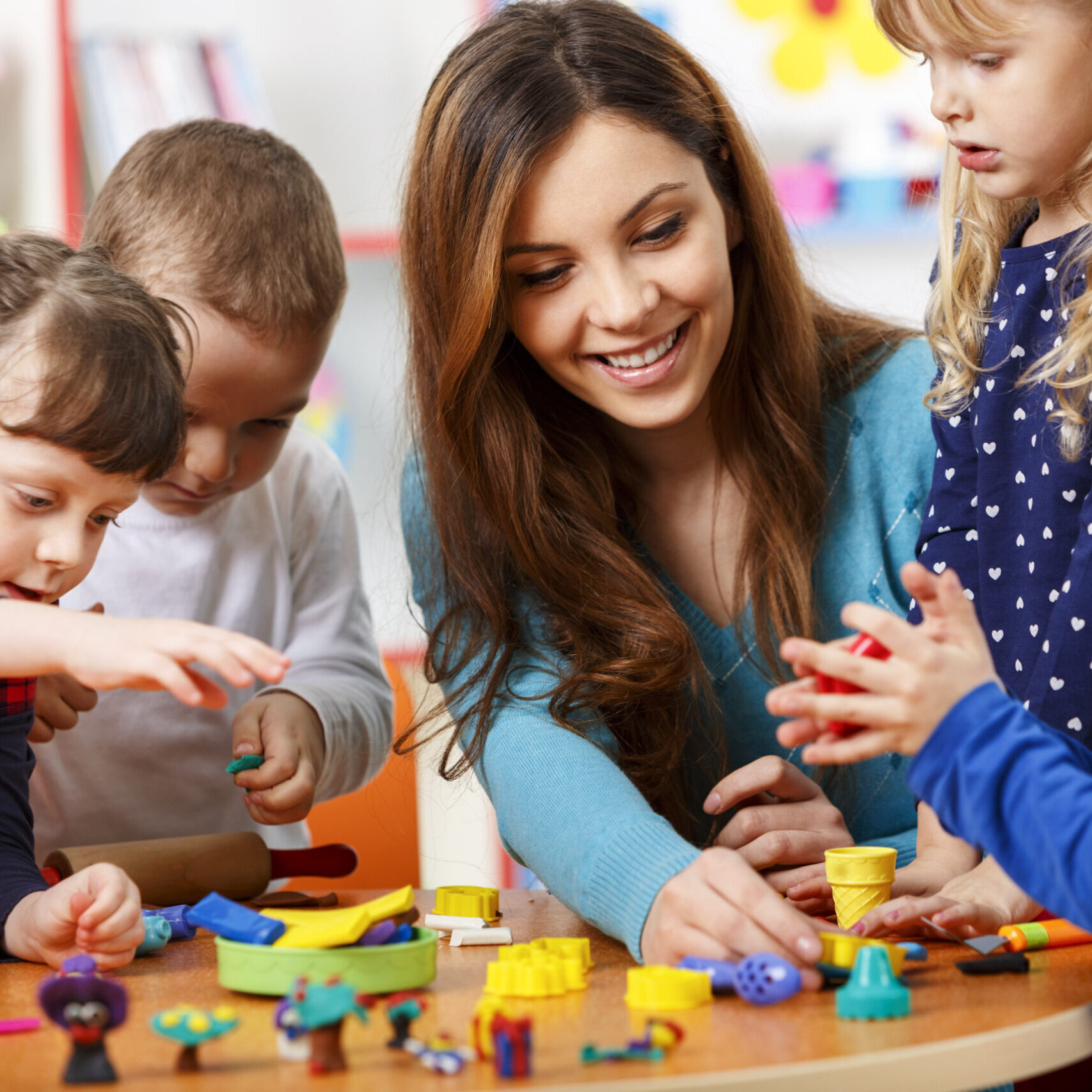 Behavioral Analyst and Children Playing with Blocks